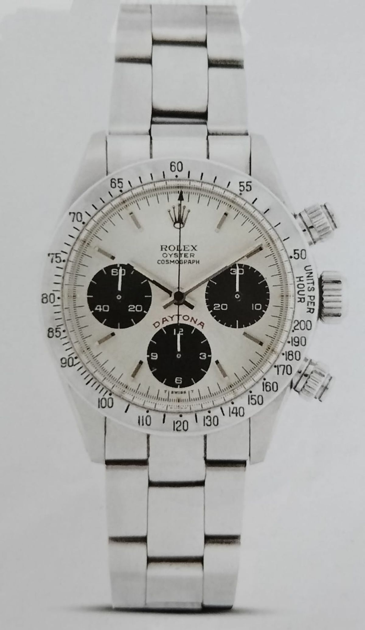 A vintage Rolex Oyster Cosmograph Daytona reference 6265 with a black dial and the word Daytona printed in red above the subdial.