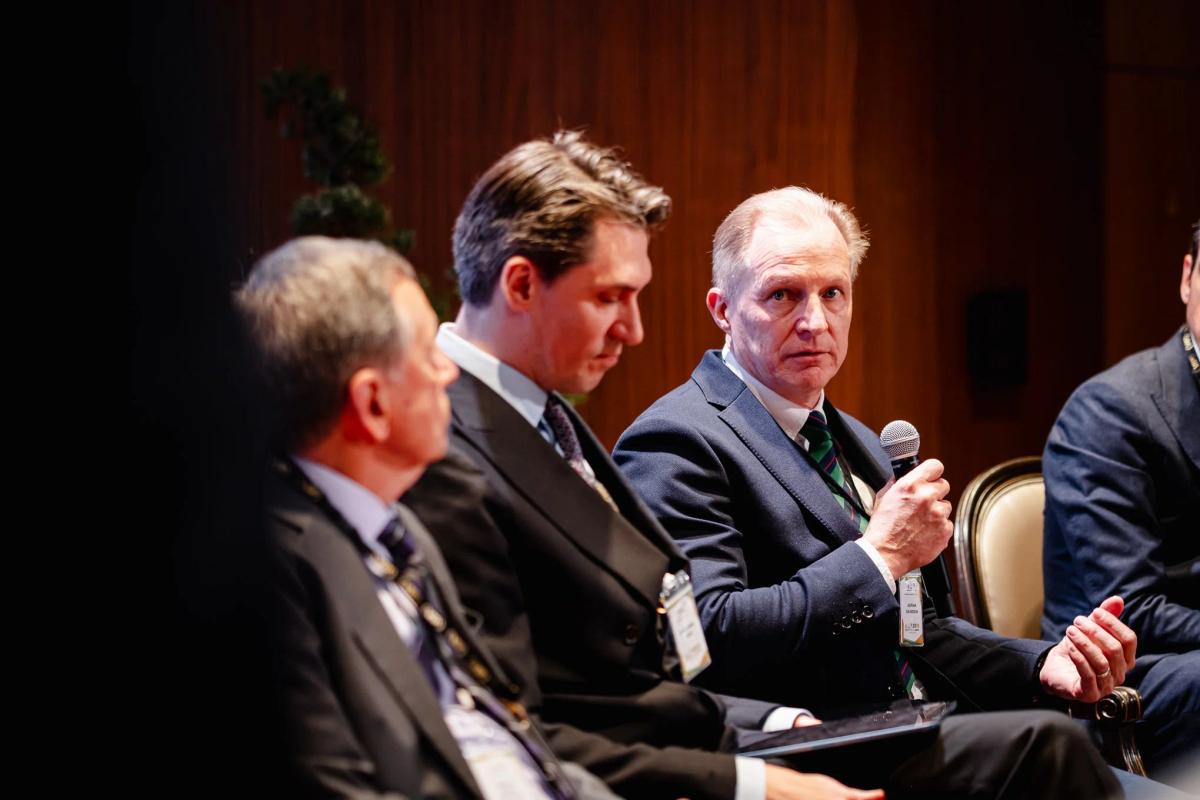  Adrian Davidson of JLL Design Lab speaking at the APA Summit Paris 2026 Panel. Photo credit to the American Phygital Association. 