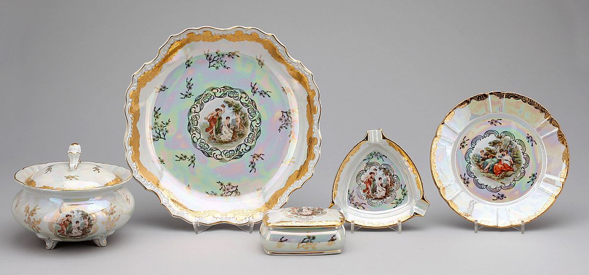 A household porcelain tea and dinner service laid out, its pieces matching and complete.