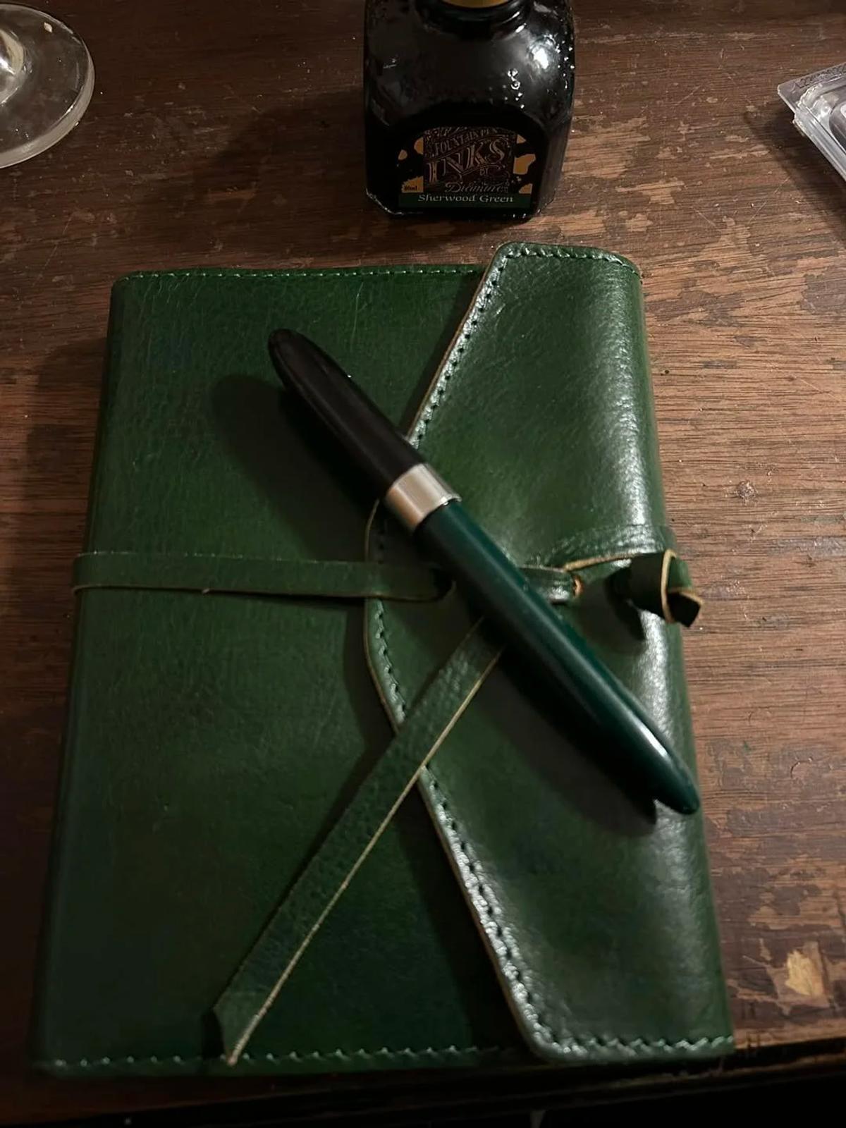  Productive Opacity: The ink-stained leather-bound journal and fountain pen constitute a vocabulary that rewards sustained attention over instant apprehension. 