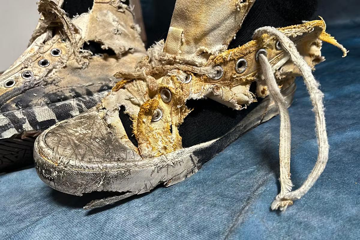  The cynical commodification of hardship: Balenciaga's 'destroyed' Paris Sneaker, a prime example of 'la pauvreté de luxe' where the visual markers of poverty are repackaged and sold as a luxury good. 