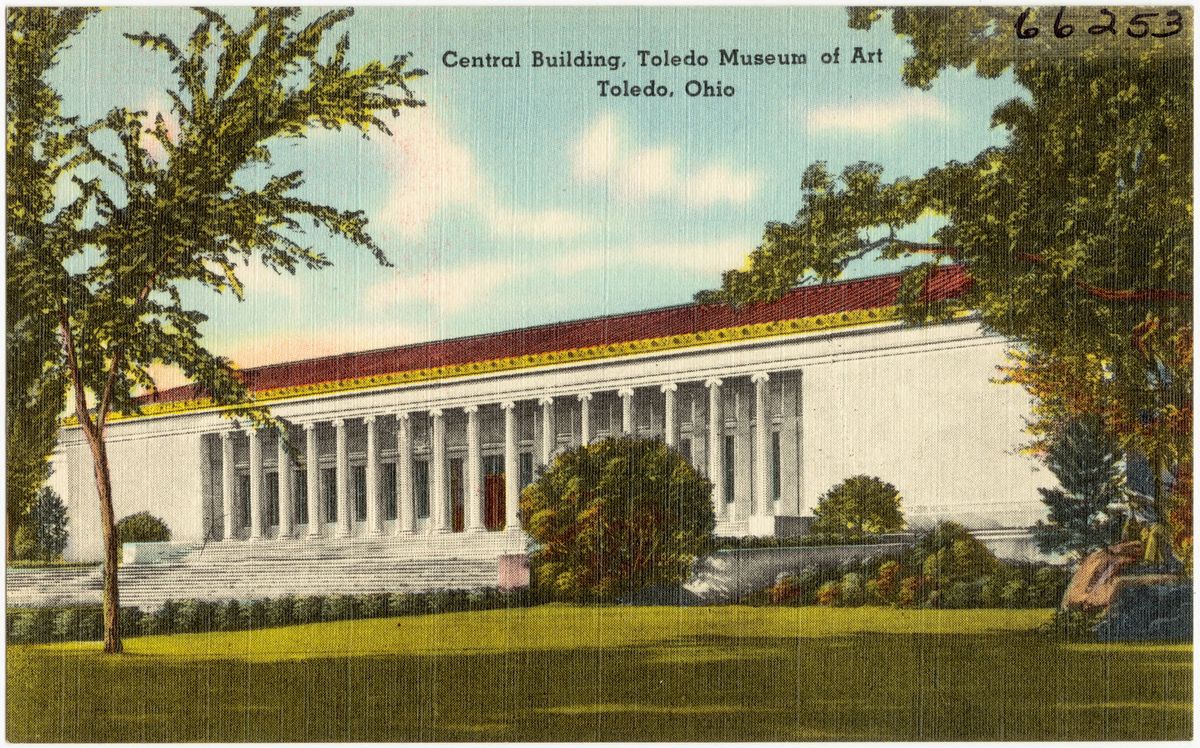 A neoclassical museum building with a long colonnade, photographed from across a lawn in an early-twentieth-century view.