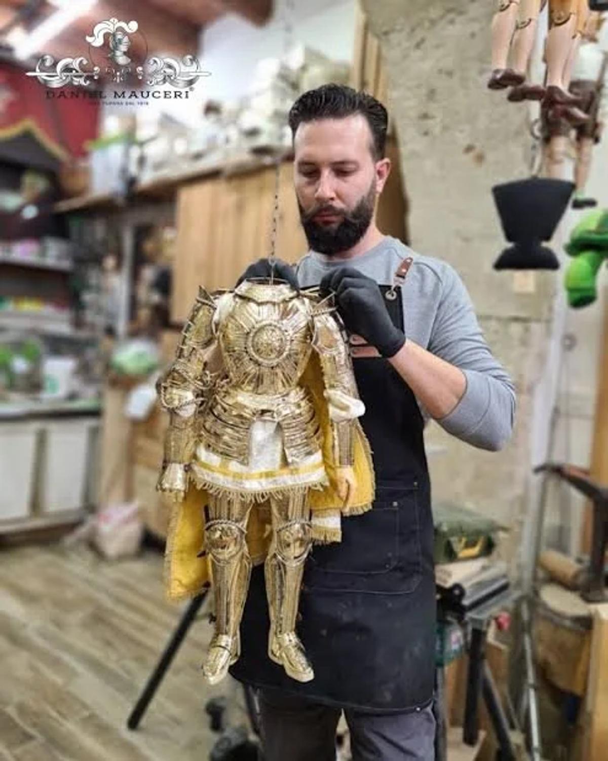 Materializing the hand: Sicilian artisan Daniel Mauceri with a pupo in progress, demonstrating the specific, independent Labor Density that can only be generated at the workshop bench, not in the corporate boardroom.