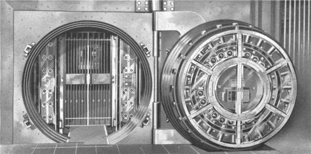 The interior of a bank safe deposit vault photographed in 1908, lined floor to ceiling with numbered boxes.