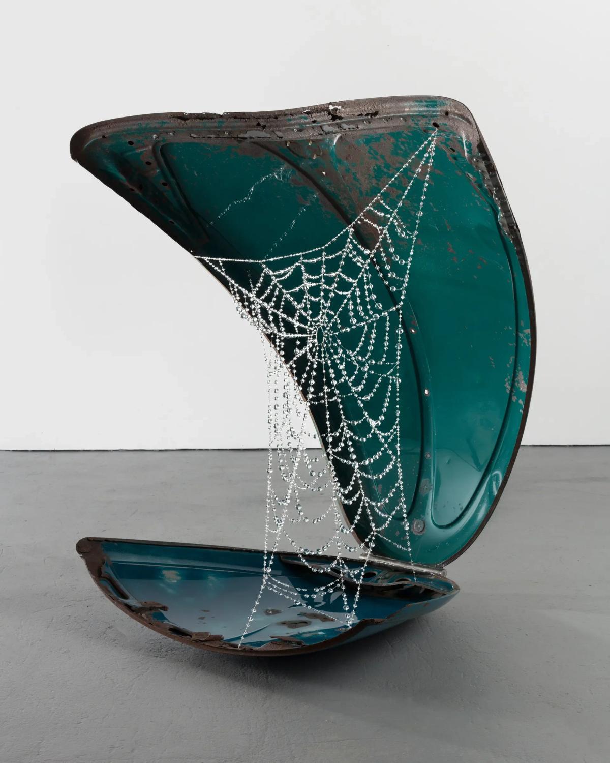 Kathleen Ryan, Generator II , 2022. In the Generator series, the material grammar shifts from biological decay to industrial obsolescence, transforming discarded automotive skins into hosts for geological intervention, embodying the PLCFA concept of the expanding material narrative.