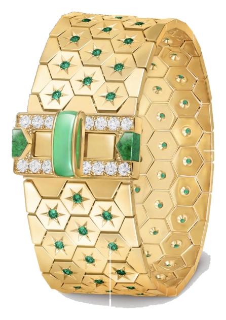 A wide gold honeycomb mesh bracelet with a buckle set with diamonds, a pale green bar and two mottled green cabochons.