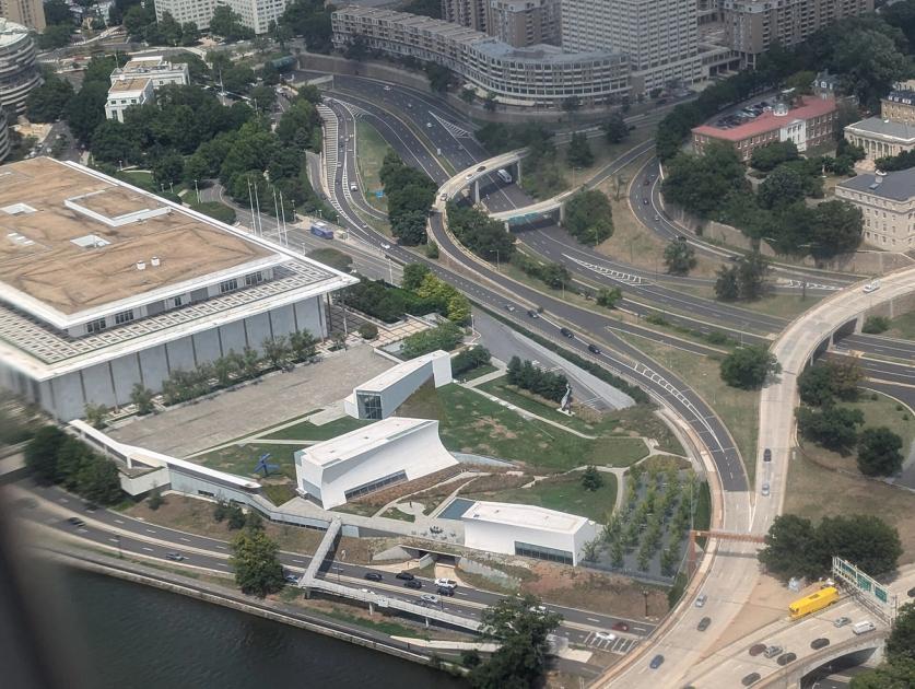 Aerial view of the Reach at the Kennedy Center, with a small blue figure sculpture standing on the lawn.
