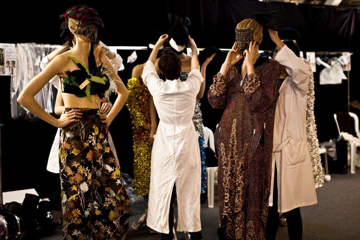  The Phenomenology of Concealment: A backstage view of the Spring 2013 Artisanal mask, illustrating the institutionalization of erasure as a luxury-theoretical strategy. 