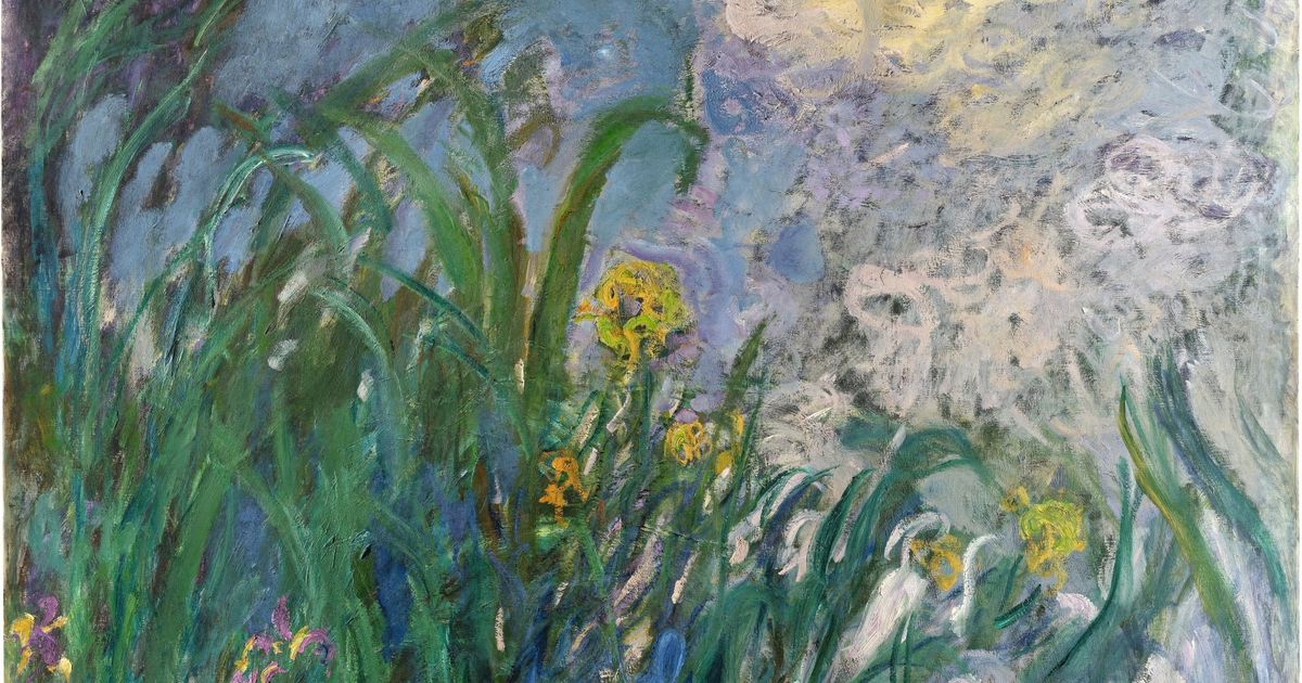 A large late Monet of irises at a water margin, green blades against blue violet water with yellow and white blooms.