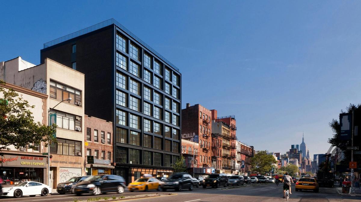 250 Bowery, designed by Morris Adjmi Architects, in its Bowery streetscape. Swiss Institute has purchased the building's ground floor and basement: the first home it has owned in forty years. Photo via Morris Adjmi Architects.