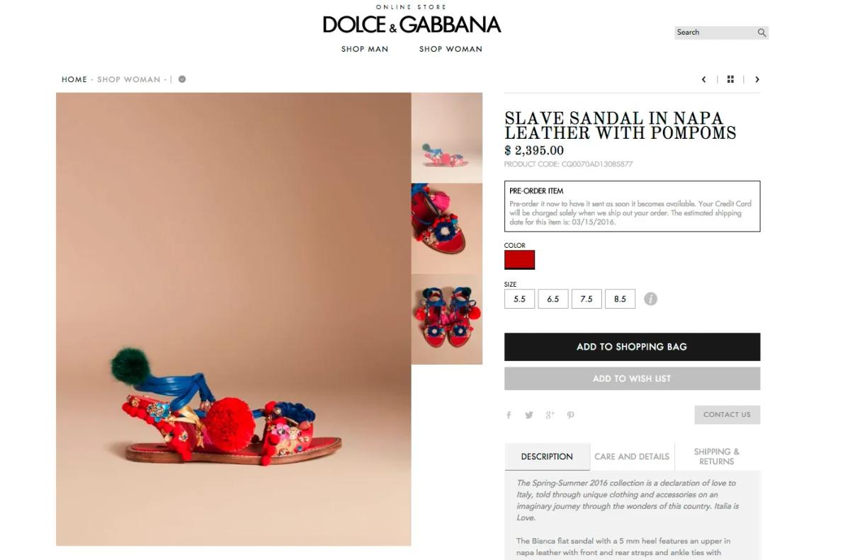 A screenshot of a designer online store product page showing a decorated flat sandal with pompoms priced at 2,395 dollars, listed under a product name that uses the word slave.