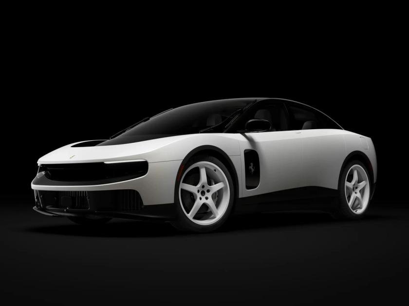 Ferrari Luce Chassis 0 shown three quarters from the front against a black background, a four door electric grand tourer in pearl Madreperla white with a black roof and white five spoke wheels.