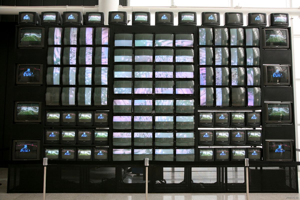 Nam June Paik's One Hundred and Eight Torments installation with multiple video monitors at a Korean venue