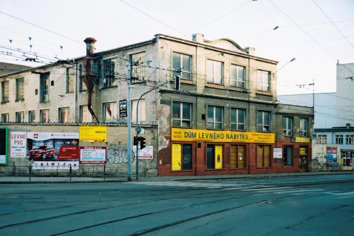 The interior of a second hand furniture shop, its floor filled with mismatched used furniture.
