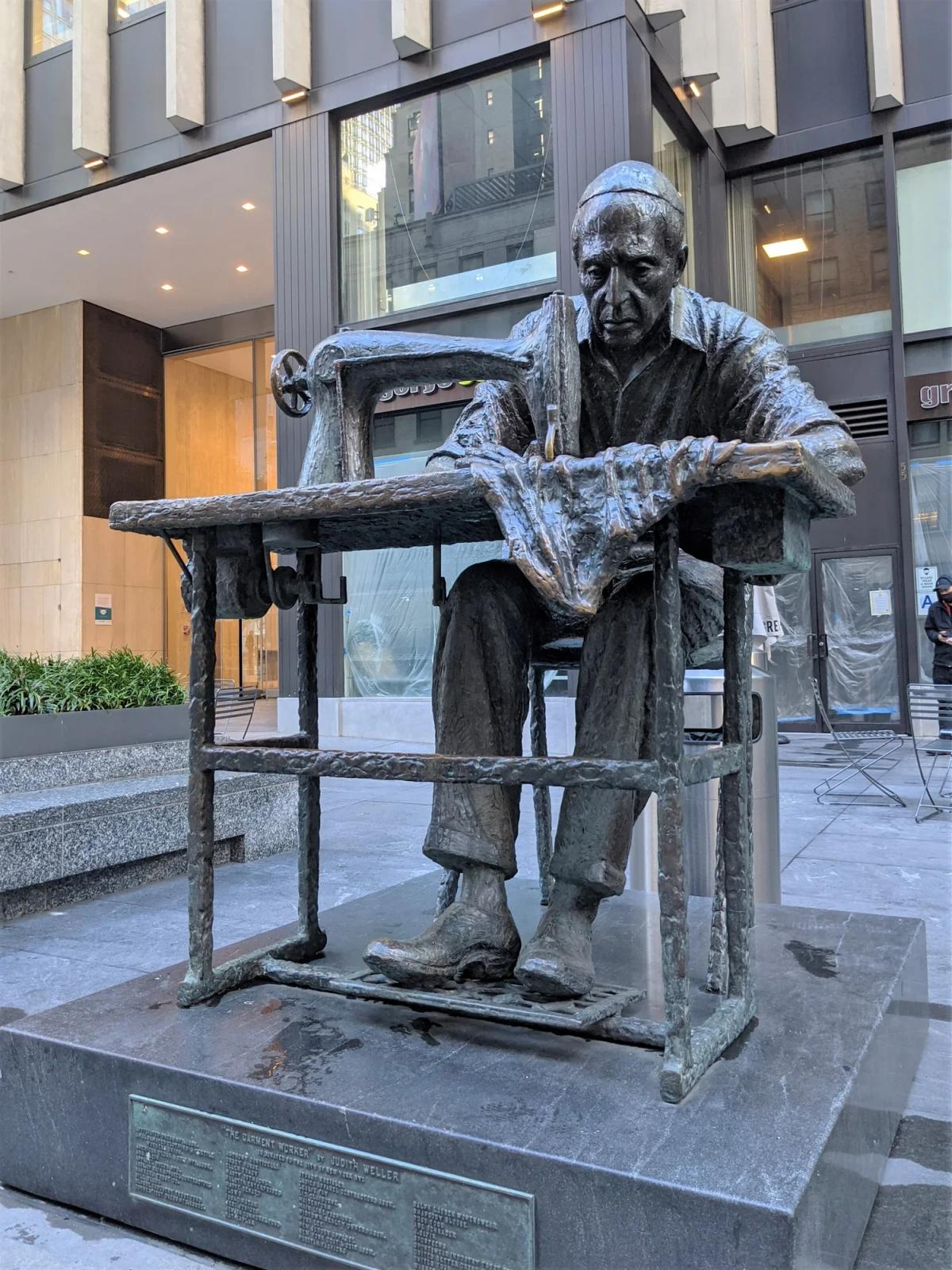 Judith Weller’s The Garment Worker statue on Seventh Avenue acts as a sentinel for the district, honoring the immigrant men and women whose organized resistance and craft shaped American fashion.