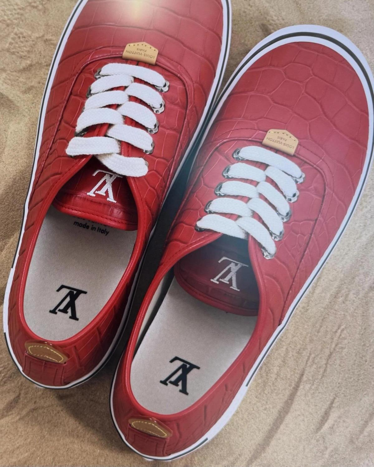 The Louis Vuitton Combi in red crocodile leather, previewed by Pharrell Williams ahead of the Spring/Summer 2027 Menswear show in Paris. The silhouette establishes the visual foundation for what the PLCFA framework diagnoses as a structural Semantic Burden Transfer, explicitly mirroring the low-profile vulcanized design language of the classic Vans Authentic.