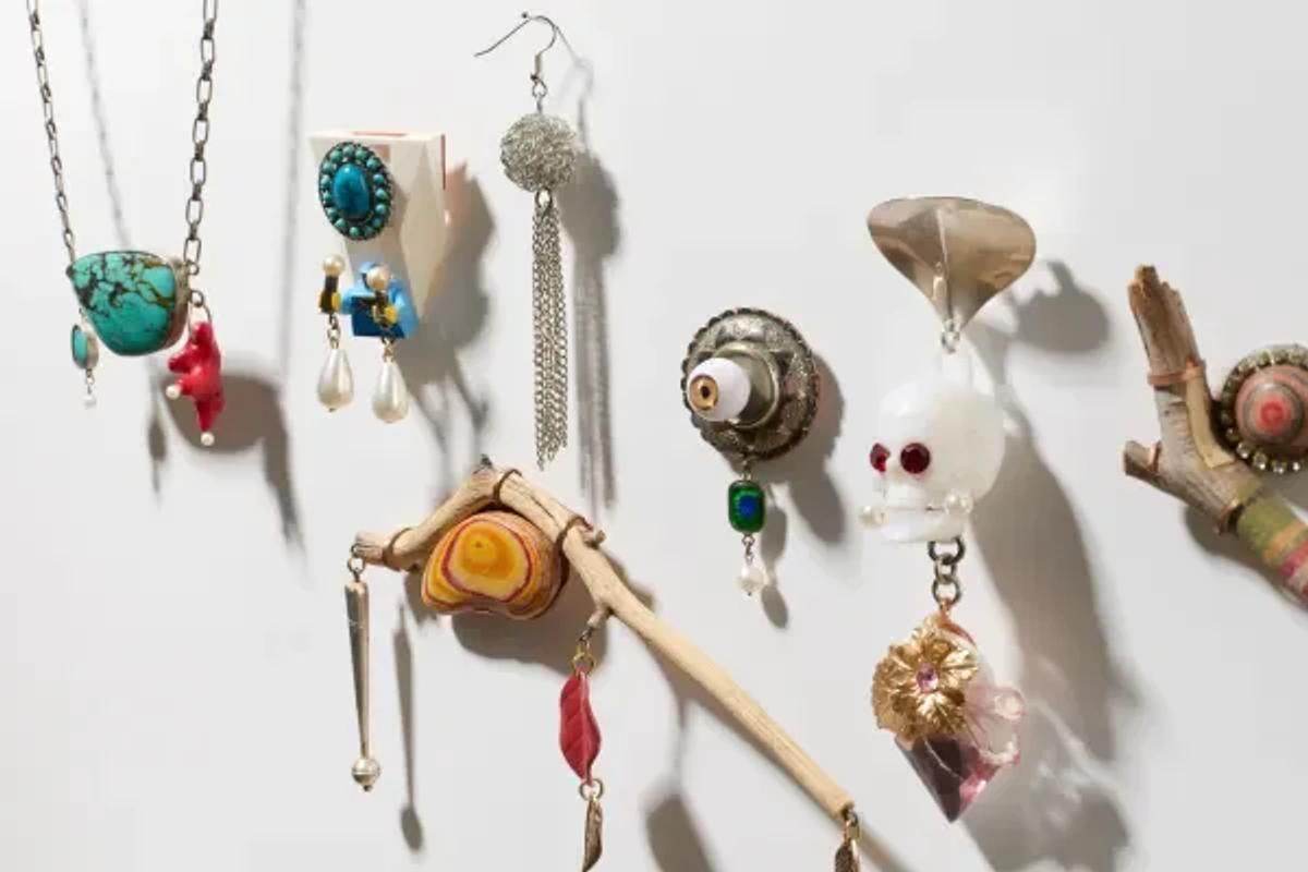 Robert Ebendorf, Assortment of Conceptual Jewelry Pieces (Various Dates). This collection of works (featuring unconventional elements like prosthetic eyes, human and animal forms, beads, and found wood) serves as the hero image for Post-Luxury Conceptual Functional Art (P.L.C.F.A.). It instantly challenges traditional notions of material value and adornment, demonstrating Ebendorf's mastery of transforming overlooked objects into philosophical statements.