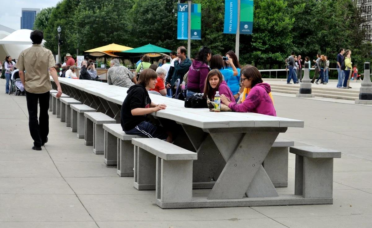 Functional critique: Dan Peterman’s recycled plastic tables exemplify P.L.C.F.A. by turning the simple functional act of sitting into a site for reflection on ecological cycles, proving that utility is inseparable from message.
