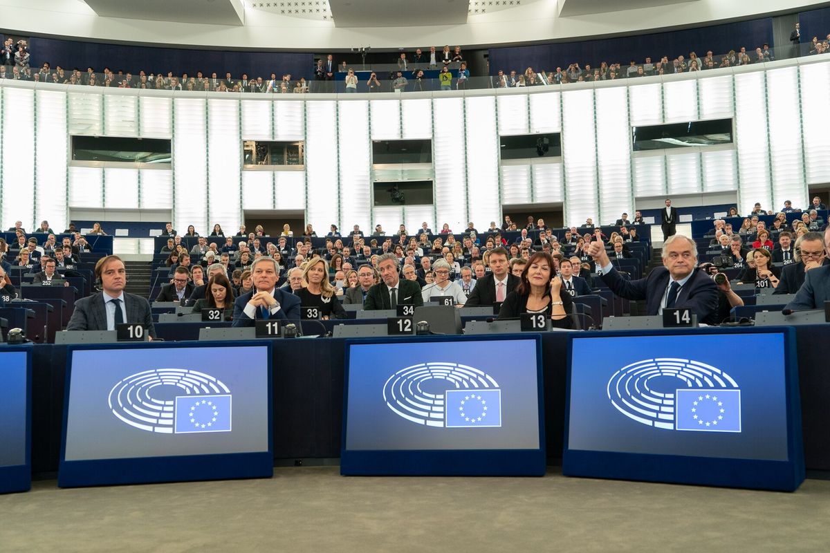 Members of the European Parliament seated in the hemicycle during a plenary voting session.