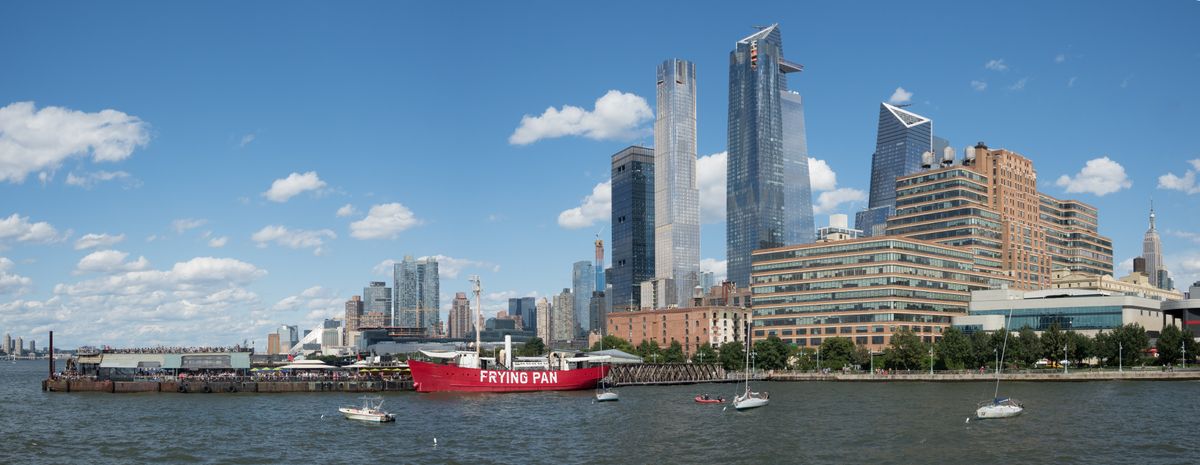 Hudson Yards viewed from Pier 66 on the Hudson River waterfront, showing the glass towers of the 18-million-square-foot private development adjacent to the High Line