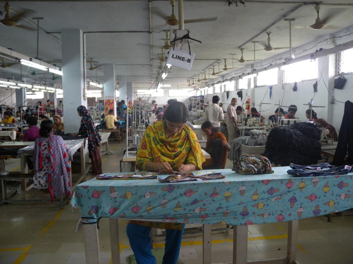 Women working in a garment factory, an emblem of the global subcontracted-labor system behind fashion production
