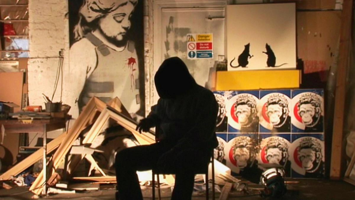 The anonymous artist Banksy, seen in silhouette during an interview for his film, Exit Through the Gift Shop.