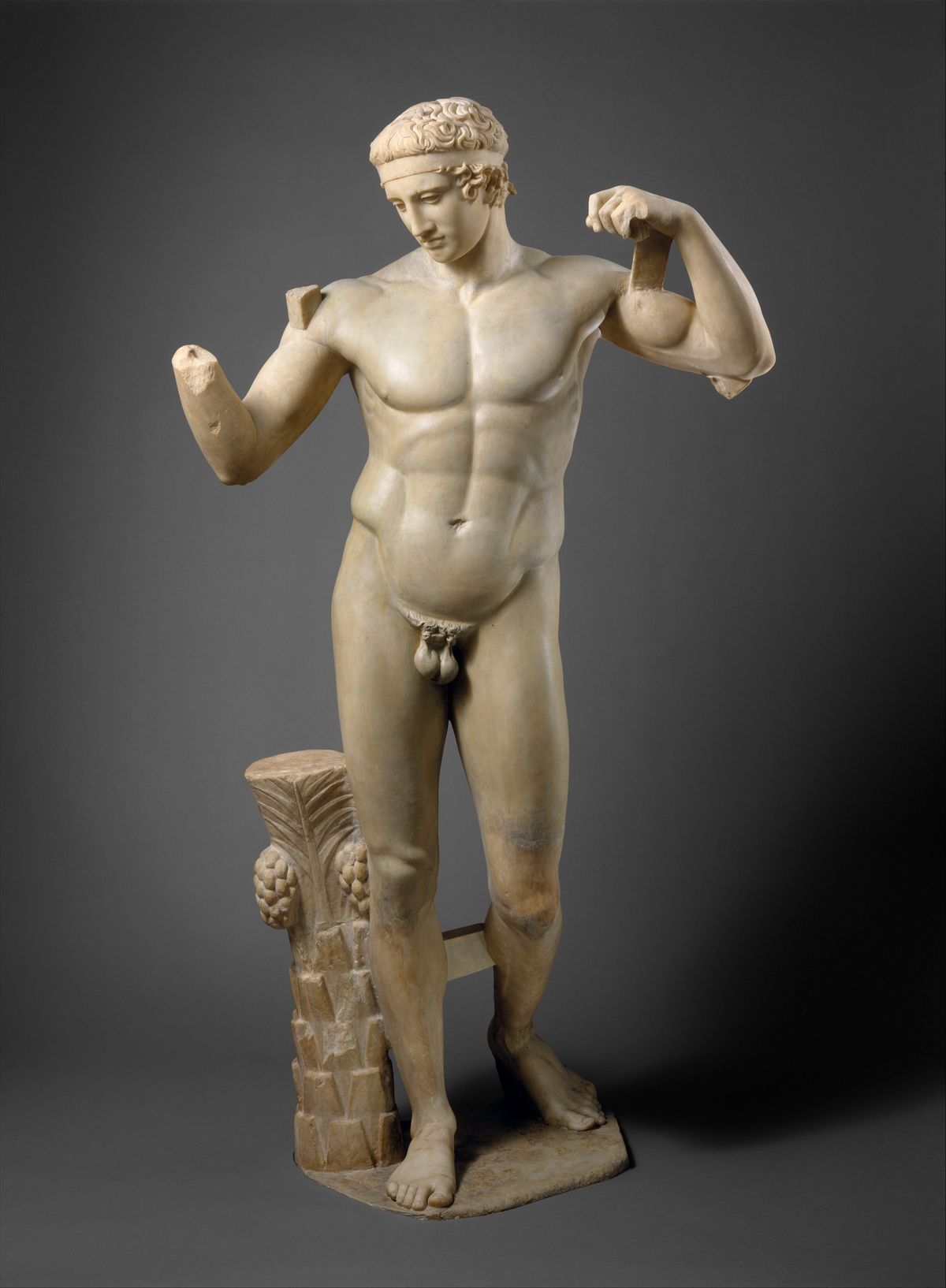 Fragments of a marble statue of the Diadoumenos, a youth tying a fillet around his head, ca. 69 to 96 CE, after Polykleitos, Metropolitan Museum of Art.