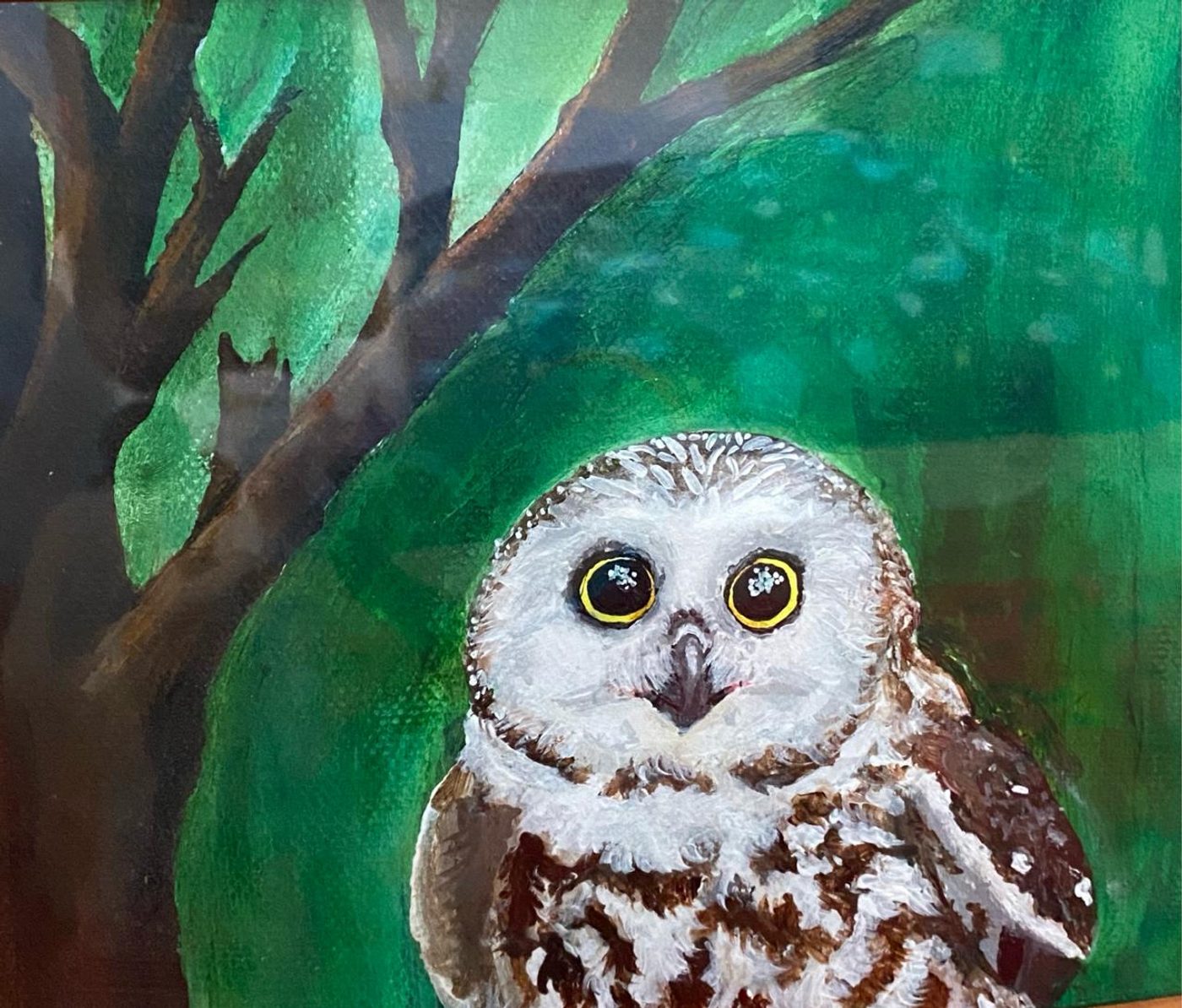 A painted owl with bright yellow-ringed eyes set against a deep green background and dark tree branches.