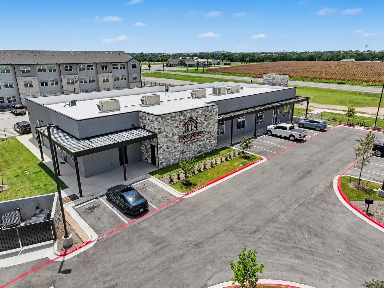 Aerial view of Homestead Animal Hospital and its parking lot in Manor