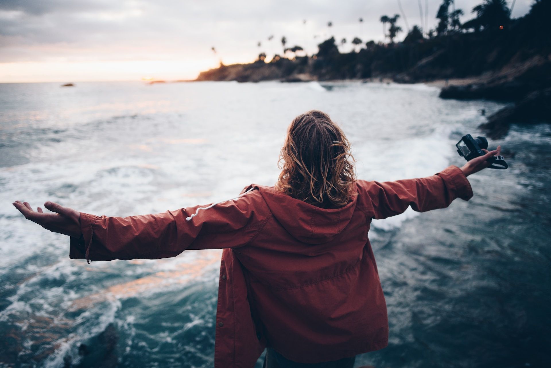 five hands of different colours sit palms down on a wooden table | five reasons self care does not work in healthcare | Tempo Therapy and Consulting