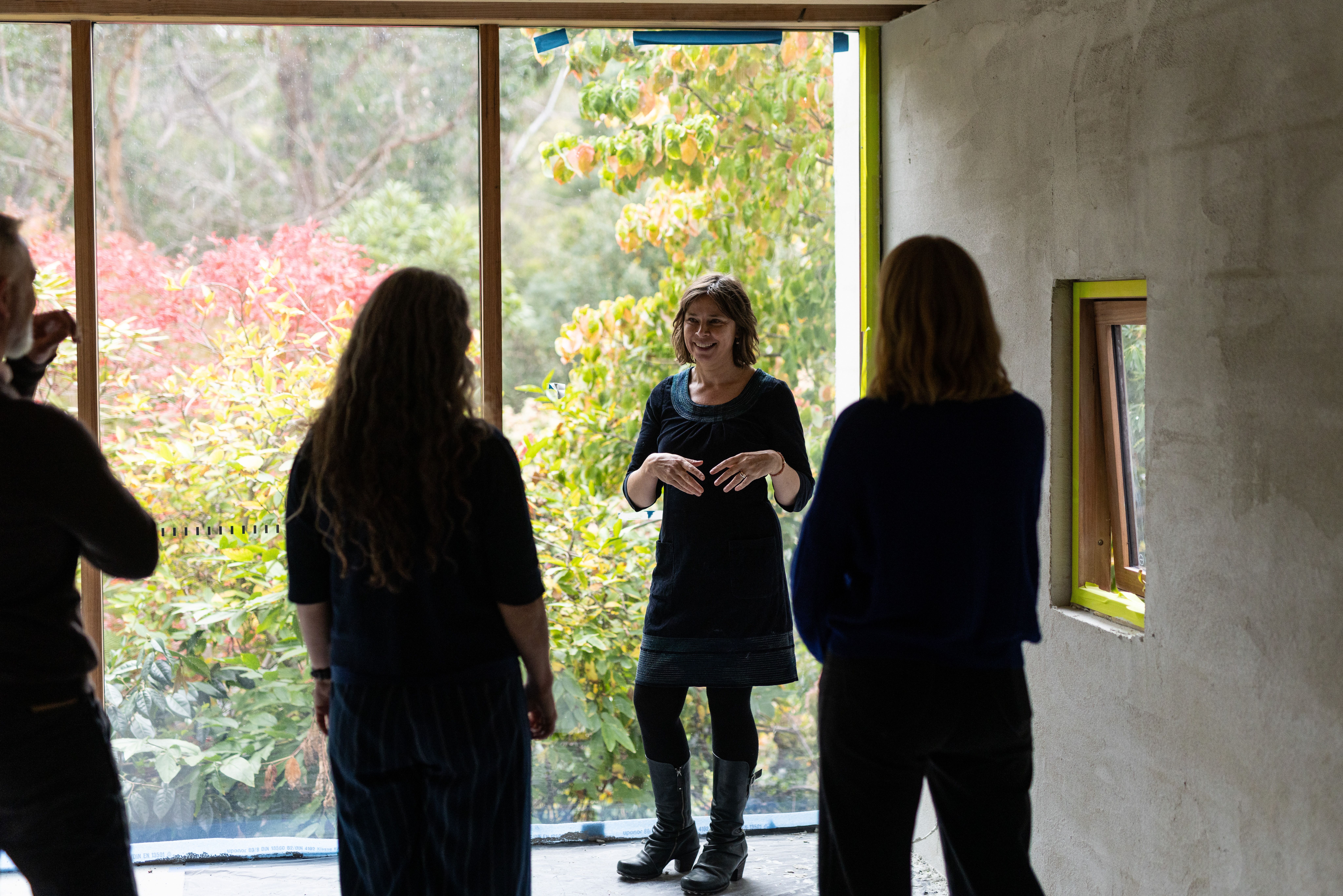 smiling white woman with short brown hair against a neutral background faces the camera  | Tempo Therapy and Consulting | Support for health and community services