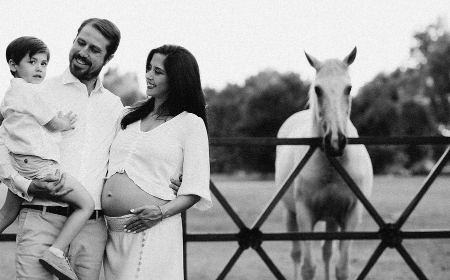 Mum-to-be with her son in a garden, black and white