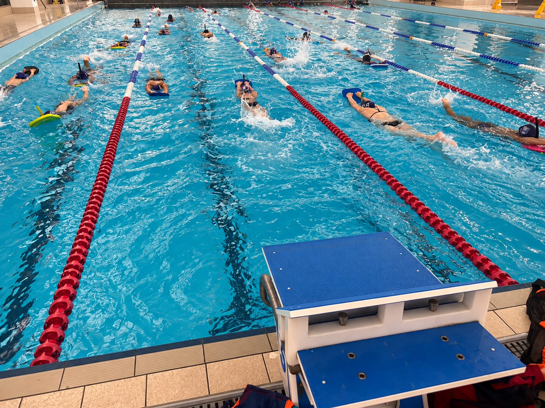 Young swimmers receiving coaching in the pool at LBHSC