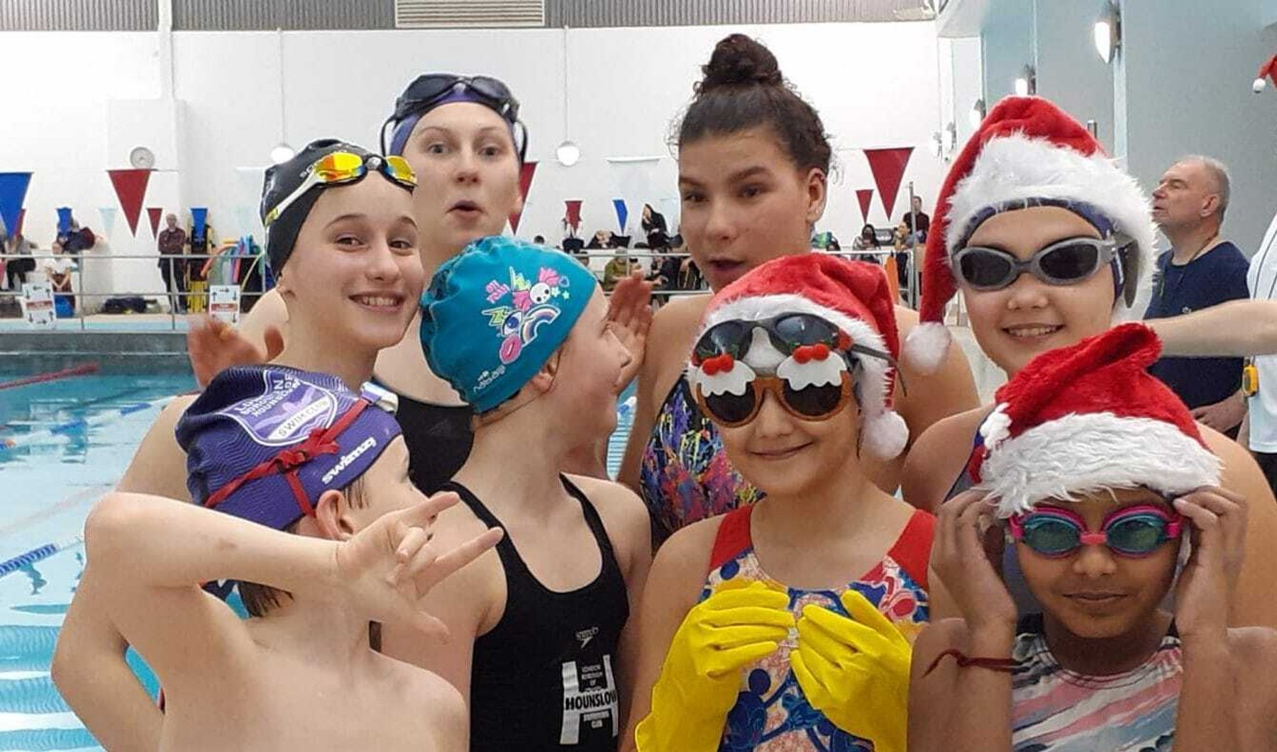 Swimmers in Santa hats and goggles at the club's Christmas session