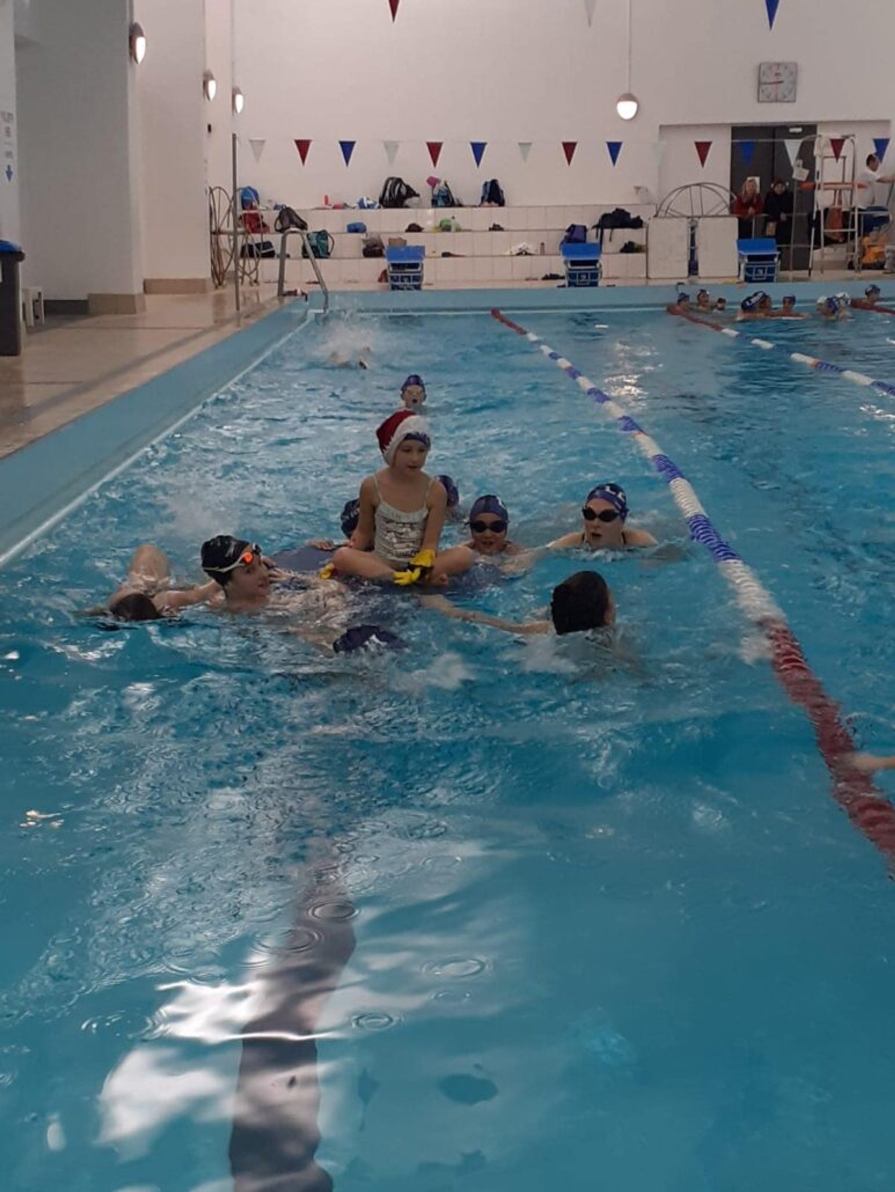 Squad swimmers training in the lanes