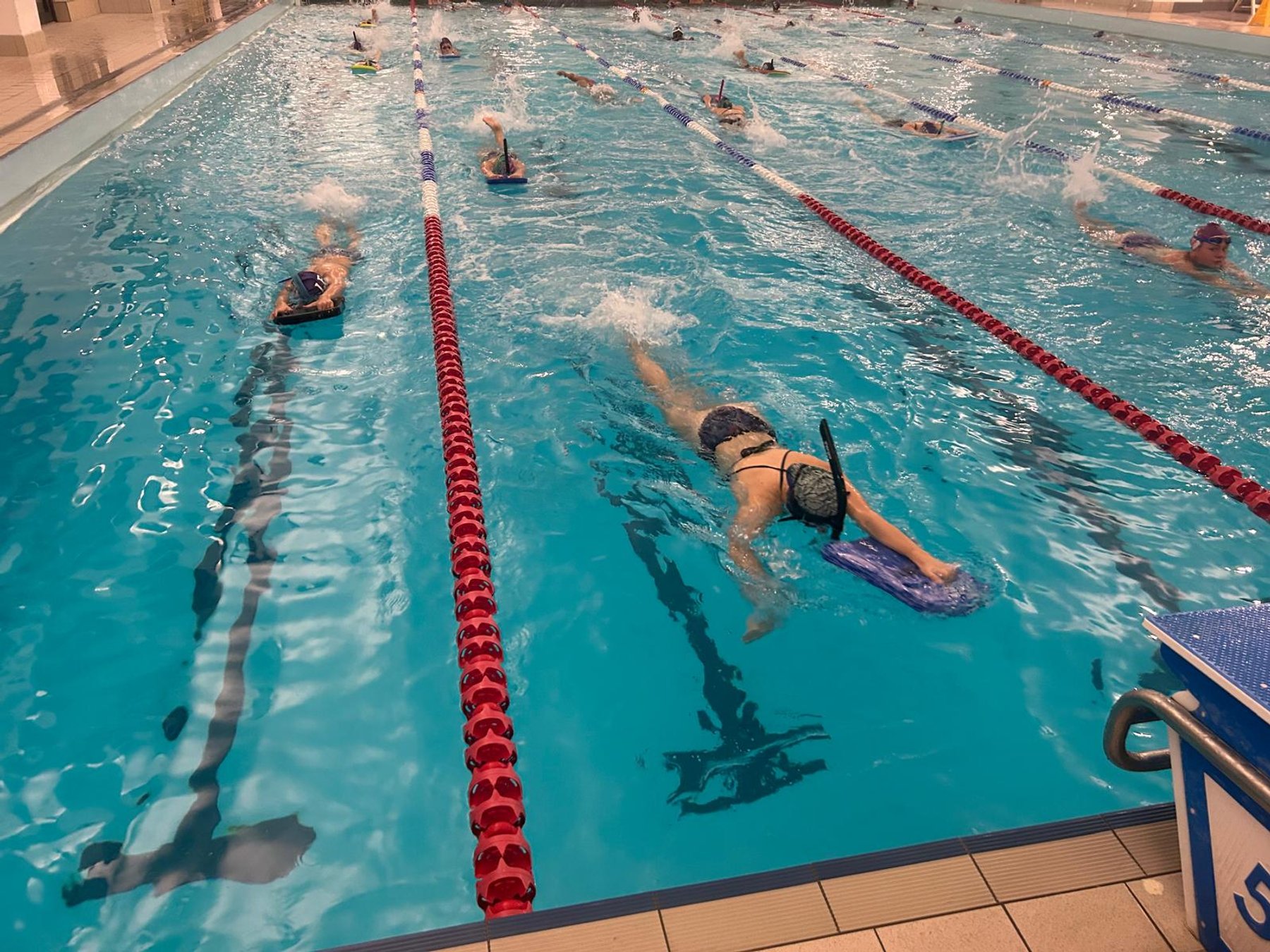 LBHSC swimmers training with snorkels and kickboards