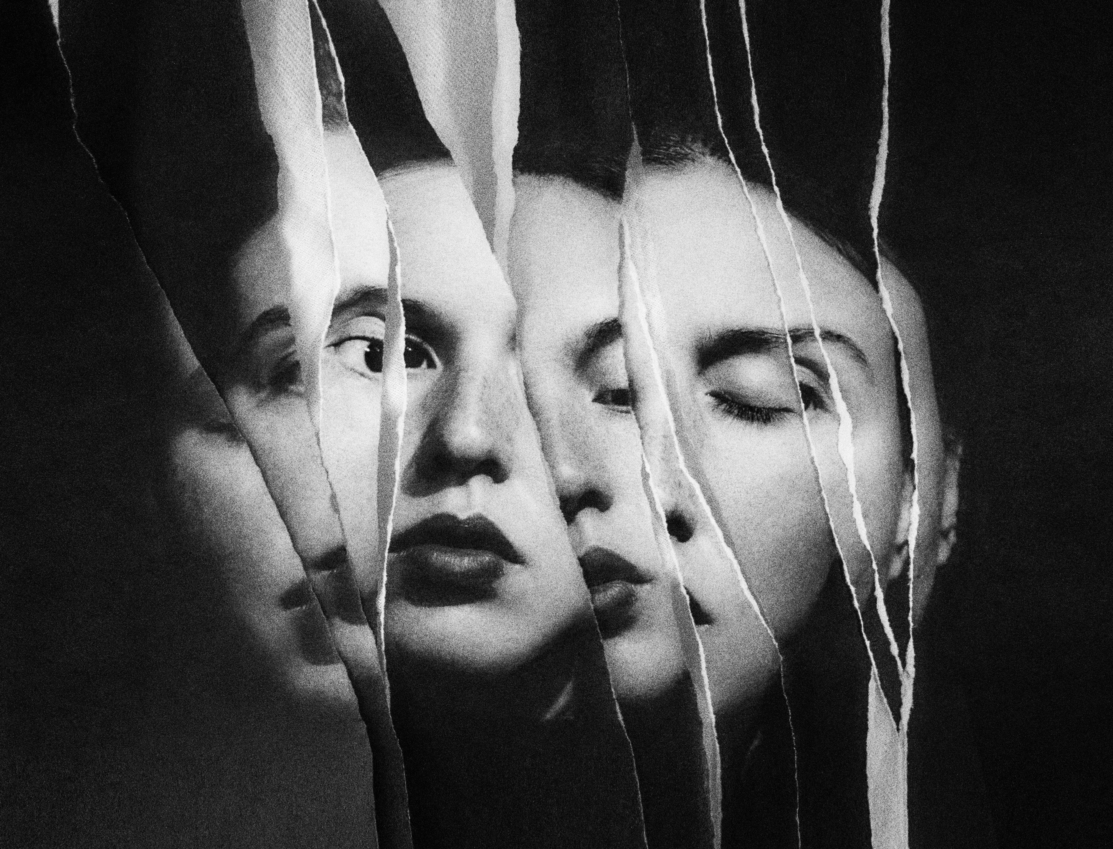 A collage of ripped paper showing various segments of a woman's face.