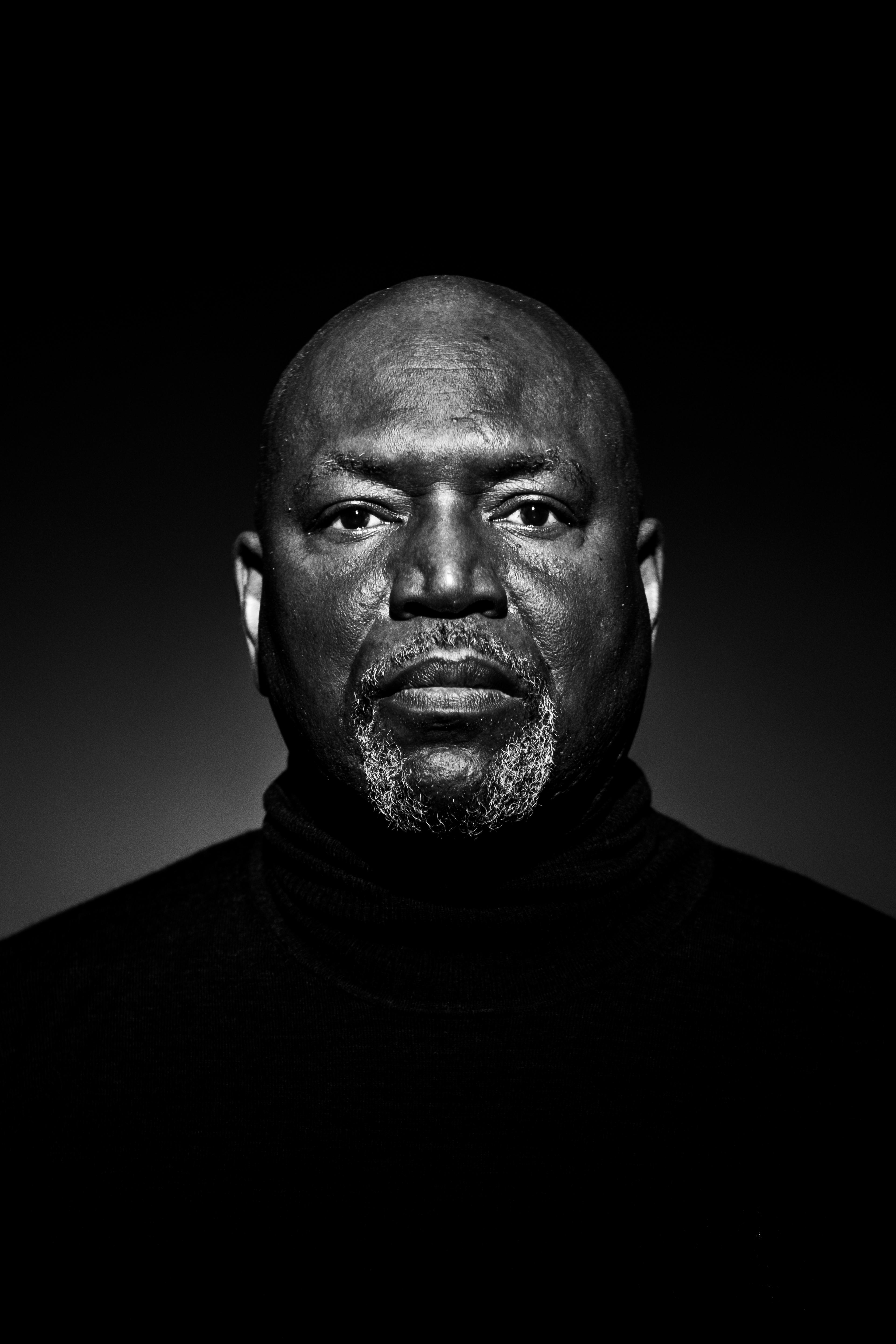 A black and white photograph of a man's portrait.