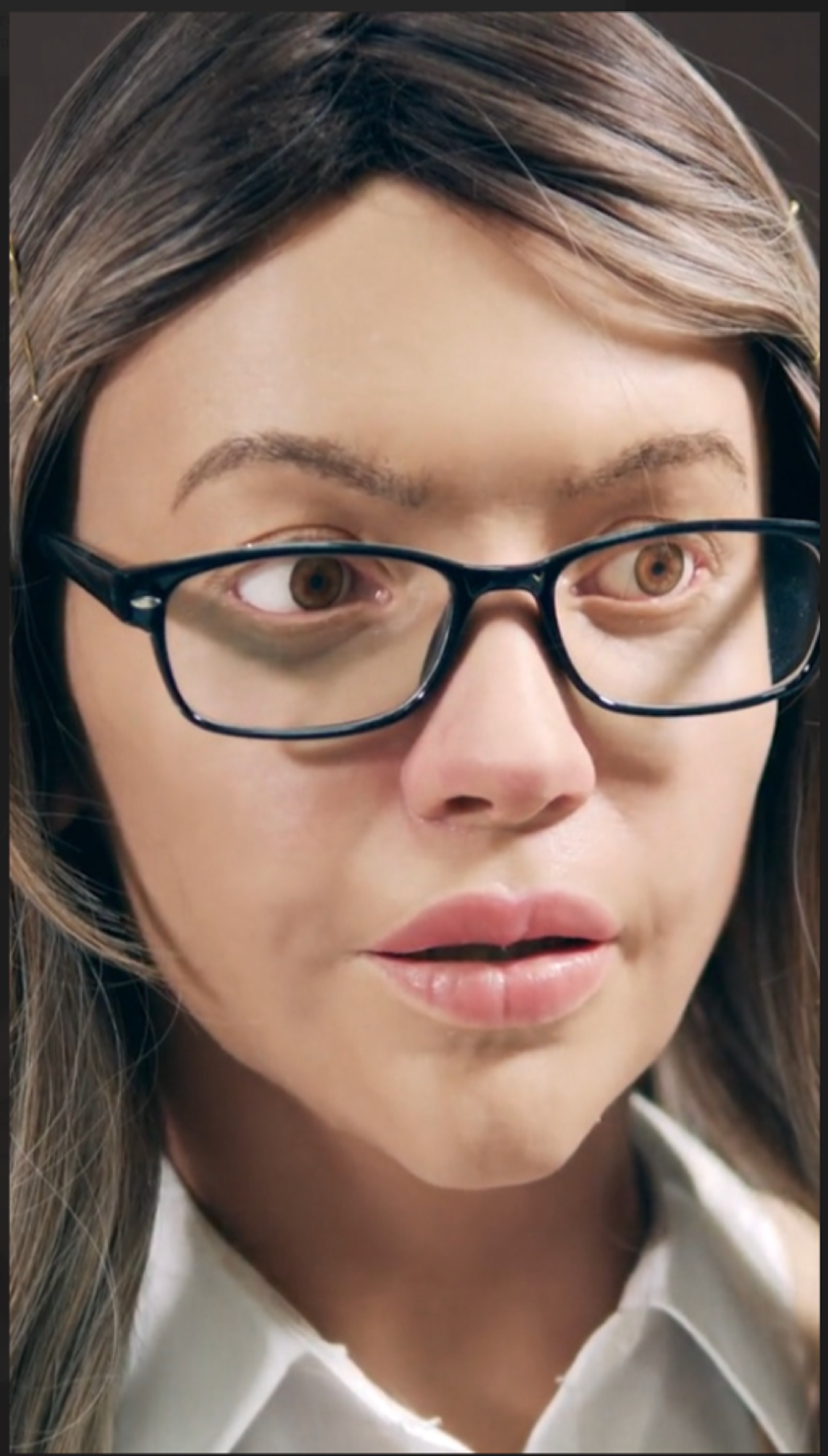 A close-up shot of a woman who wears glasses.