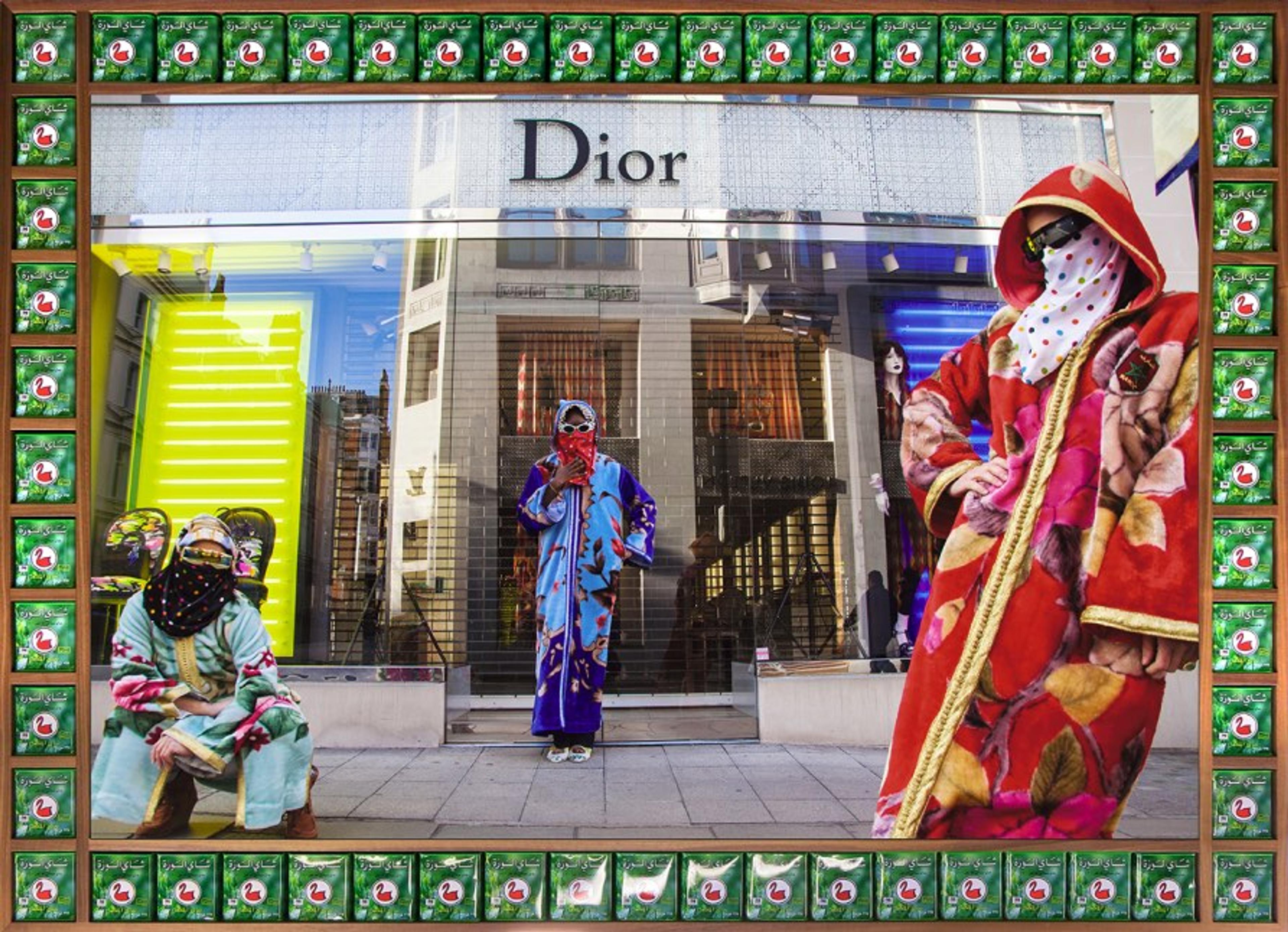 A photograph of three people wearing brightly-colored djellabas and hijabs in front of a Dior store