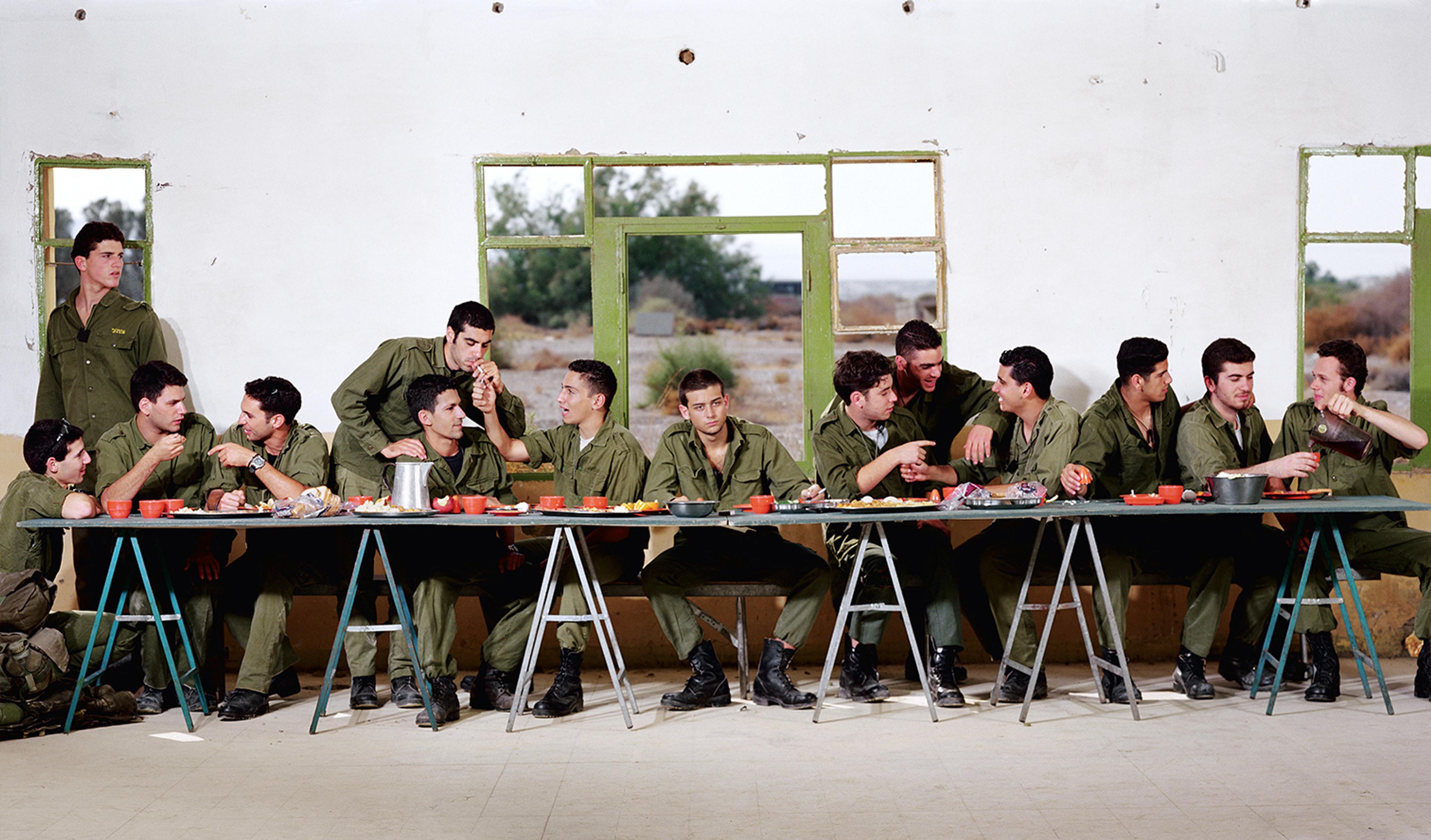 A photograph of men in military uniform at a long dinner table, reminiscent of The Last Supper