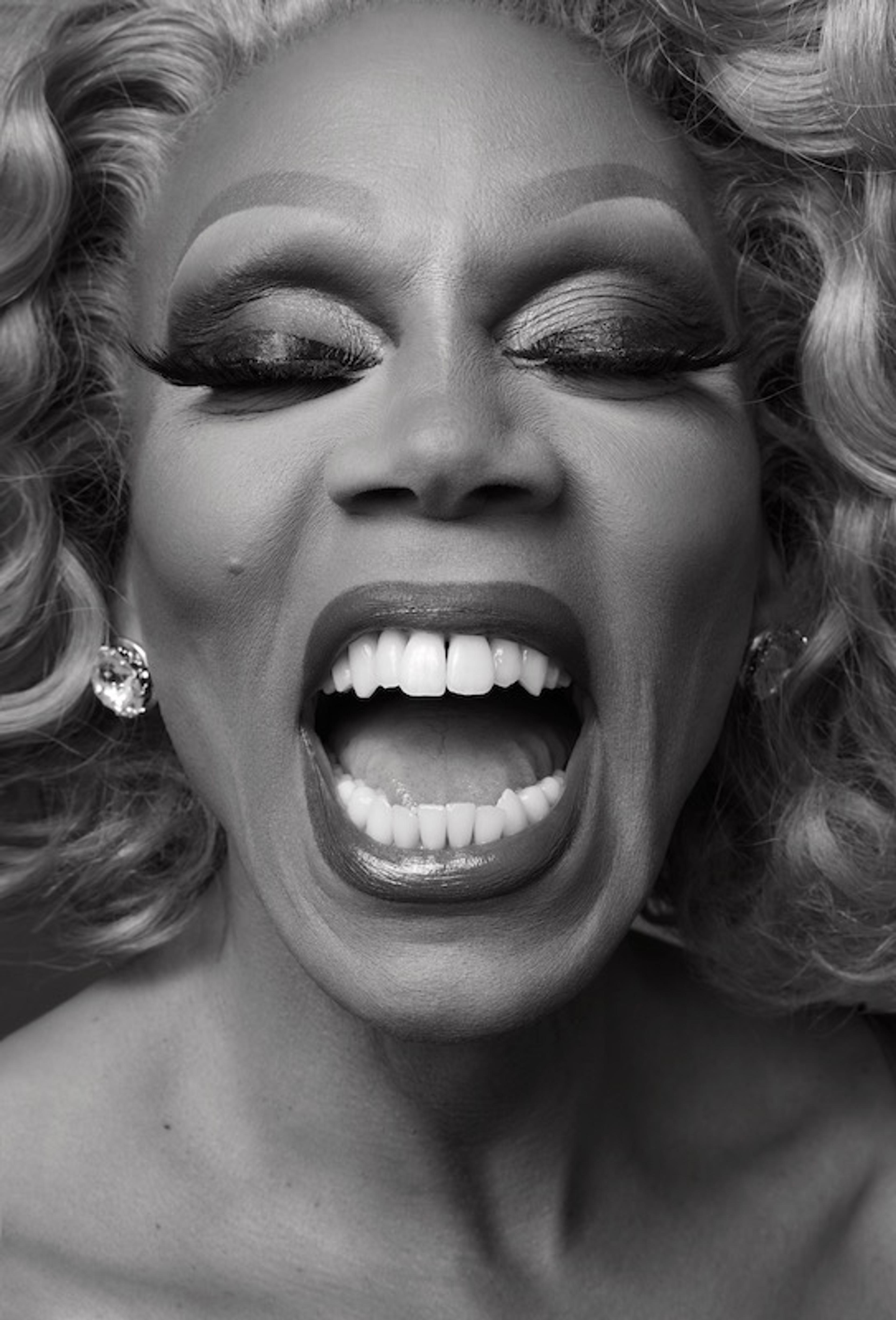 A black and white up-close portrait of Rupaul Andre Charles wearing makeup