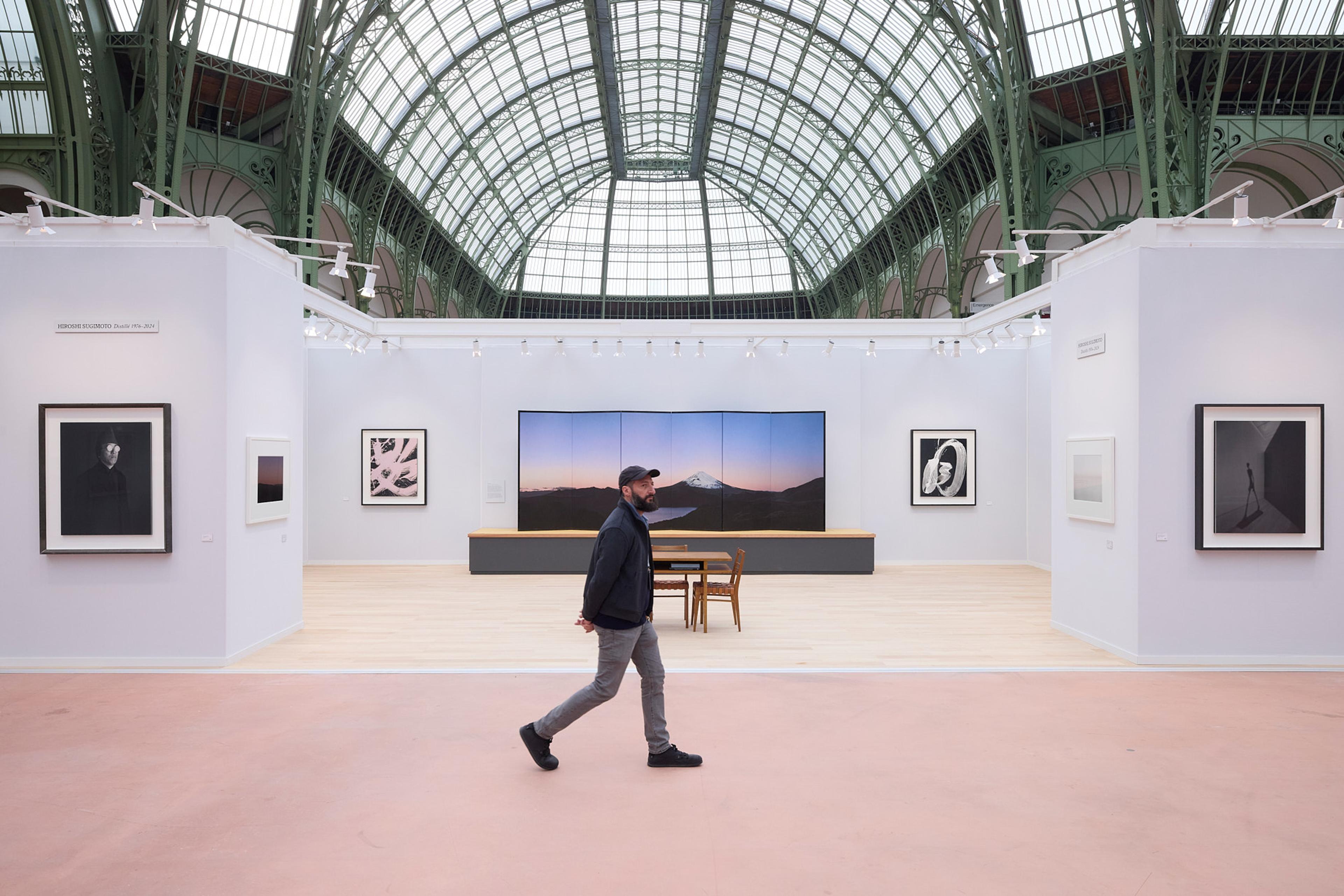 A view of the inside of the Grand Palais building with a view of the domed glass ceiling