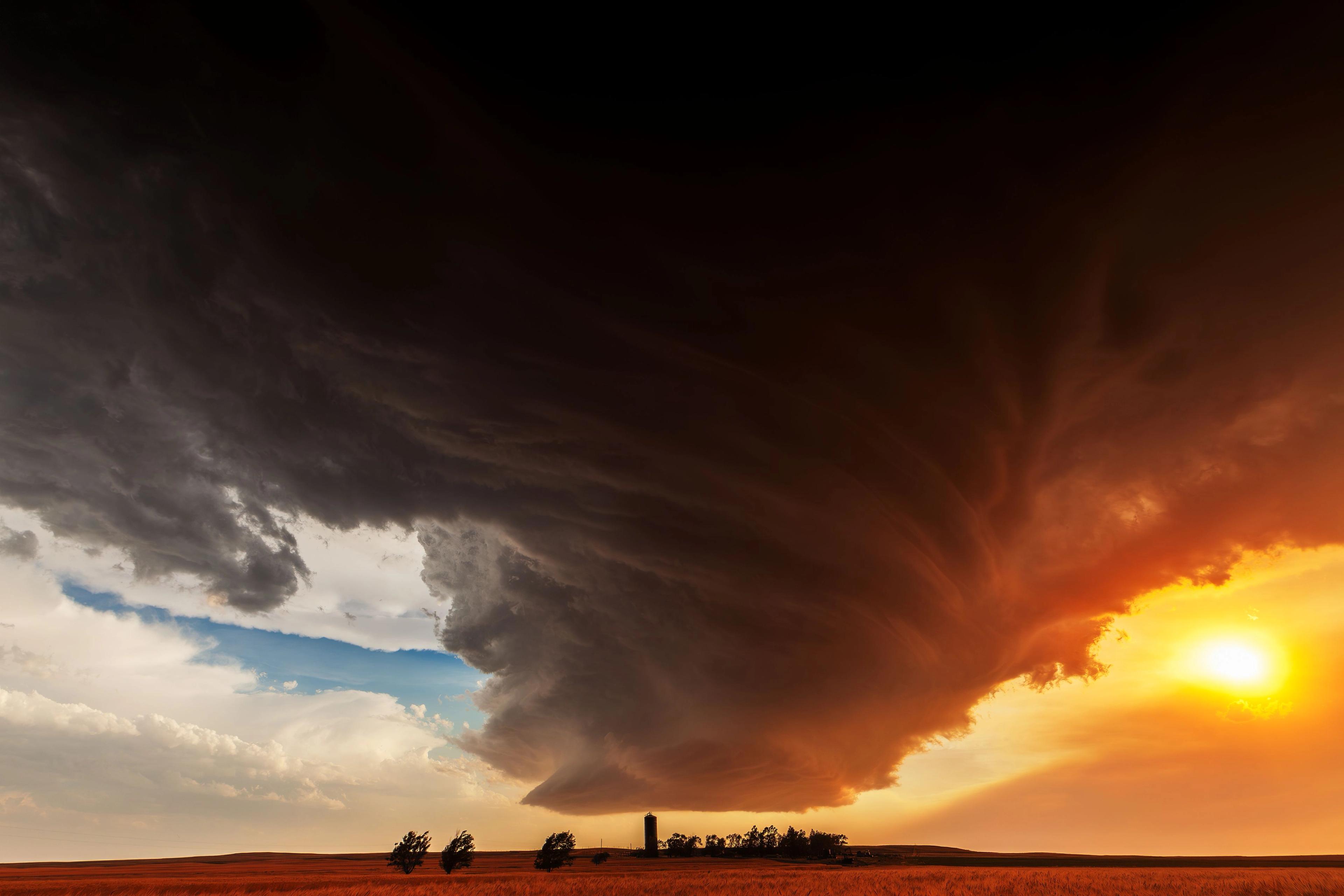 Camille Seaman, "The Lovely Monster over the Farm, 19.15 CST, Lodgepole, Nebraska, 22 June 2012" (2012). From the series "The Big Cloud" (2008–14). Image courtesy of the artist