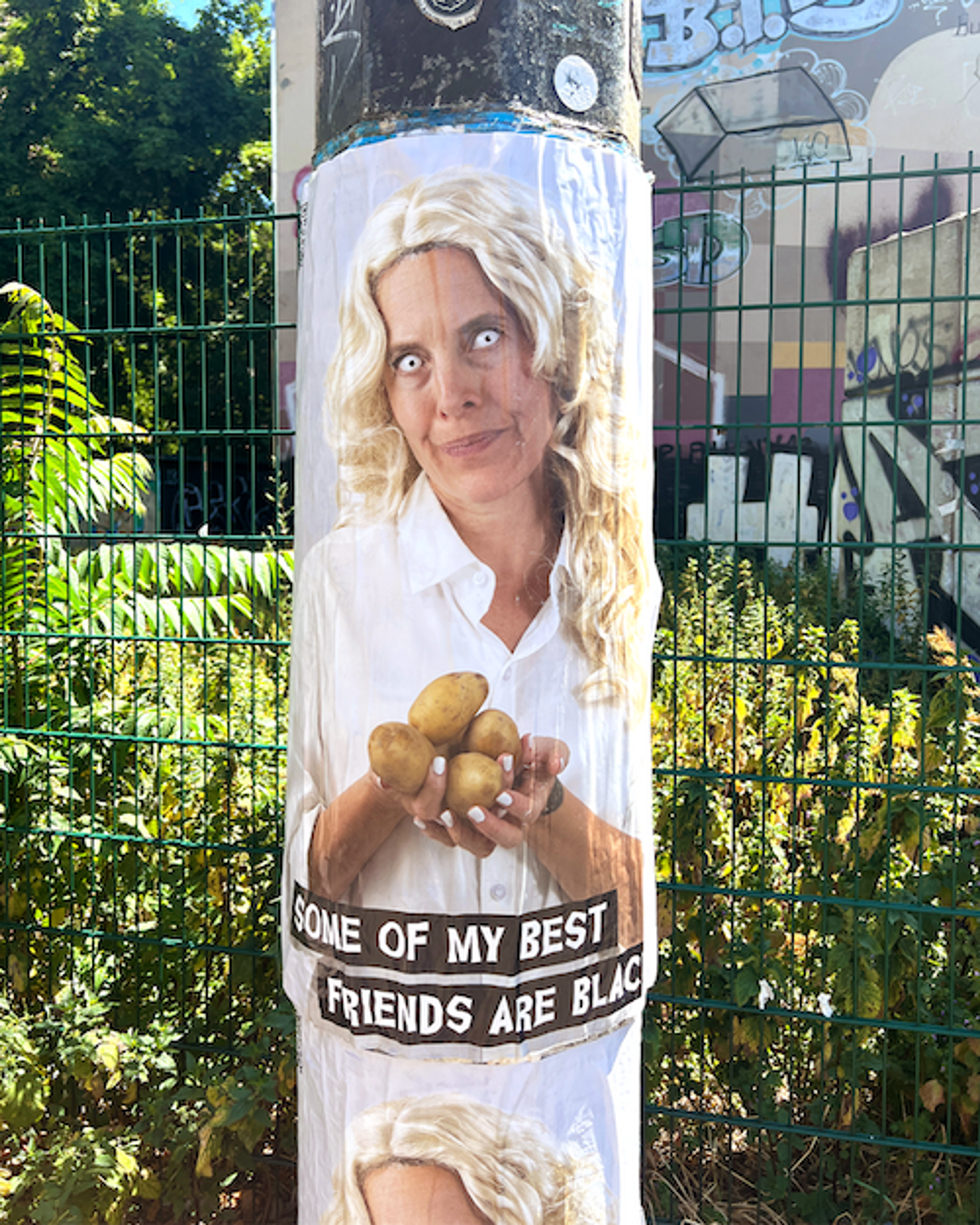 A poster on a pole featuring Candice Breitz.