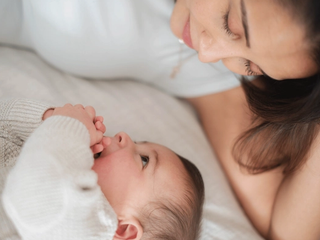 Mum and baby smiling at each other