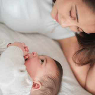 Mum and baby smiling at each other