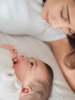 Mum and baby smiling at each other
