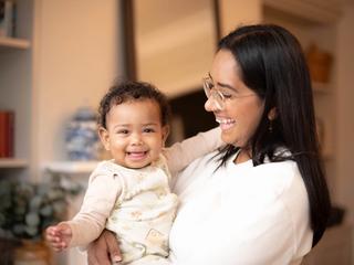 Mum laughing with baby