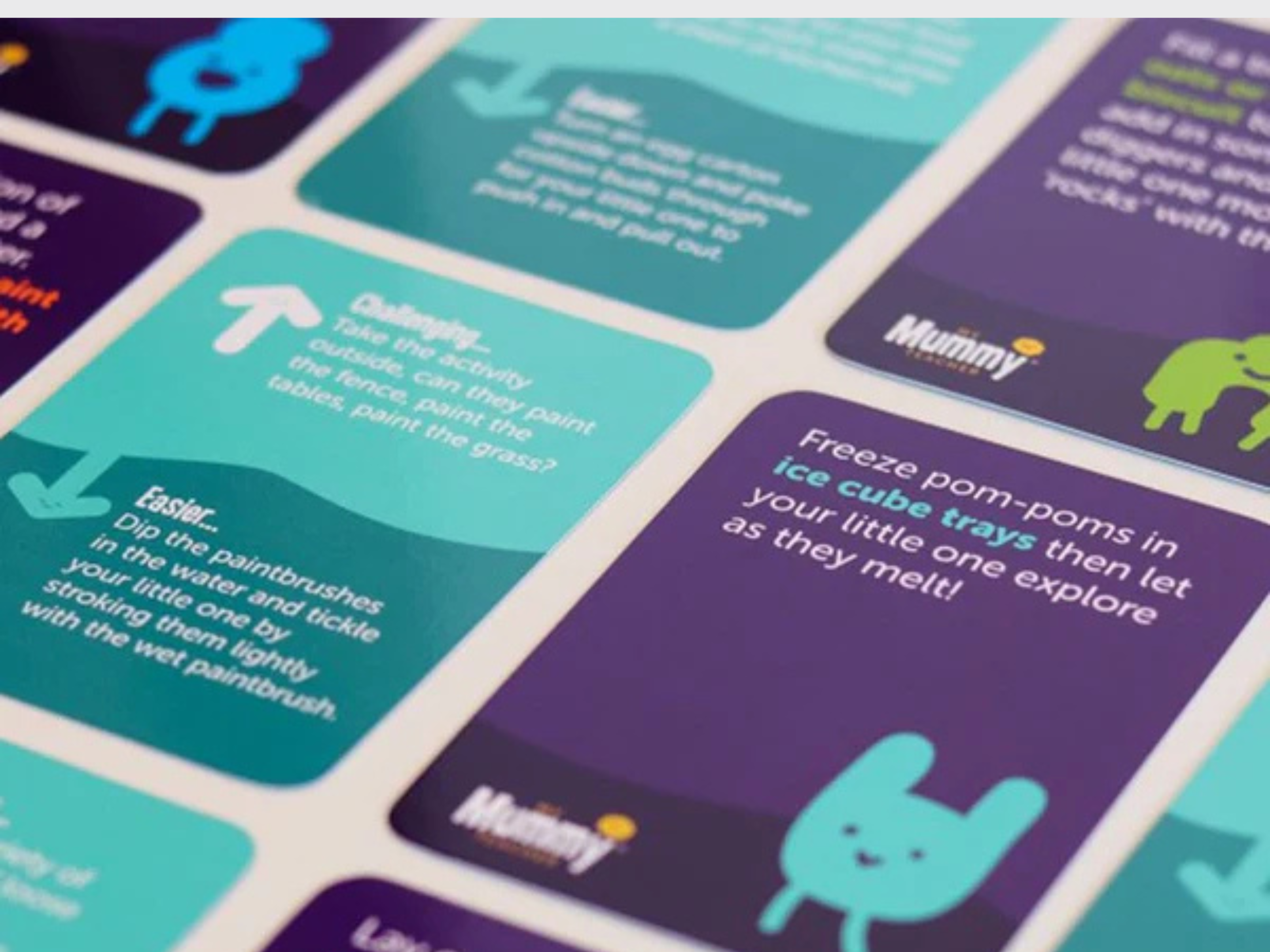 Play activity cards laid next to each other across a table